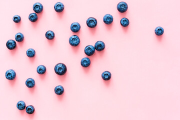 blueberries on pink background. Top view. Flat lay