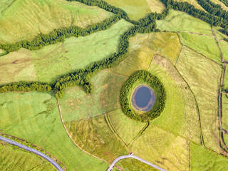 Abstract shape formes. Aerial view of lagoon in the Azores islands. Drone landscape view with lines and textures in the background. Top view of volcanic crater, tourist attraction of Portugal.