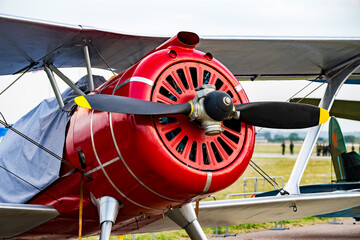 Fragment propeller with engine and retro airplane close up. Screw plane