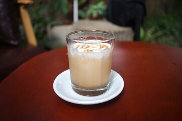 Iced Latte coffee in a grass