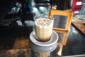 Iced Latte coffee in a grass