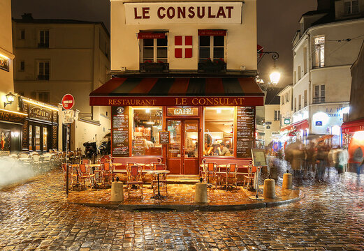 PARIS , France- November 11, 2017: View of typical paris cafe in Paris. Montmartre area is among most popular destinations in Paris, Le Consulat is a typical cafe.