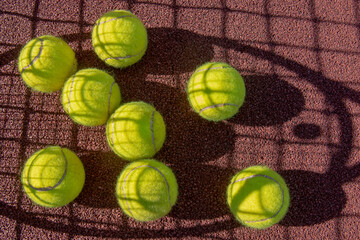 tennis ball on the court. hard court. sunny day.