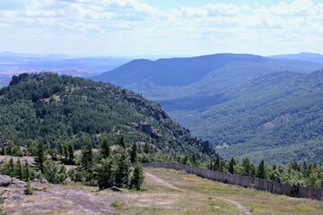 Perfect summer landscape. A field with a mountain in the background. Top view