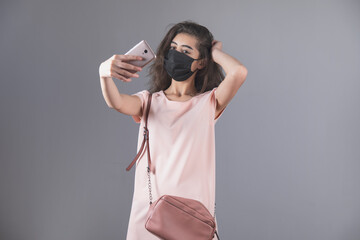 woman face mask and selfie