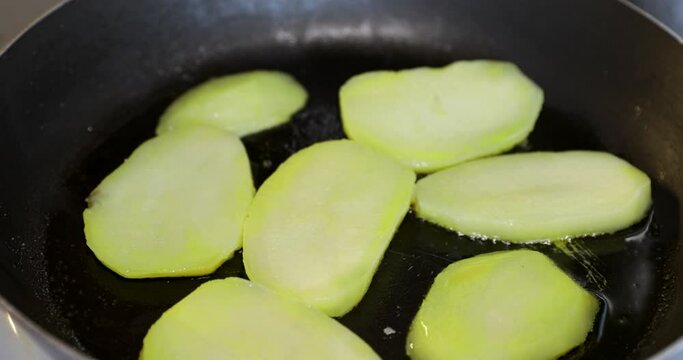Close up shot of frying potatoes