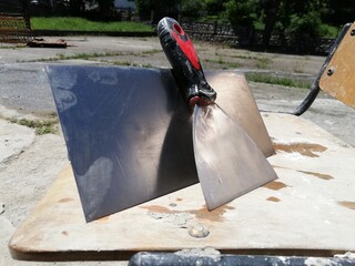 Craftsman plaster tools. Polished trowel,  putty scraper and trowel
