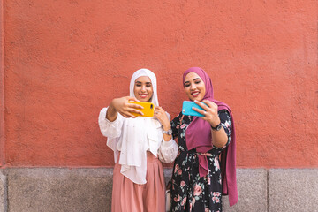 Beautiful Arab Girls Taking Selfie Outdoors. Lifestyle Concept.