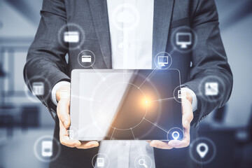 Businessman hands holding tablet with abstract digital interface on screen.