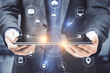 Businessman hands holding digital tablet with abstract digital interface.