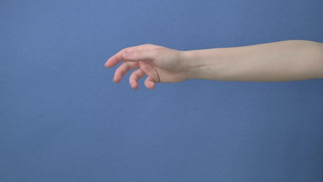 To reach with a female hand for something. Place for advertising. Copy space.
