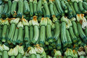 Fresh zucchini in the greek market in Chania, Crete as a background.