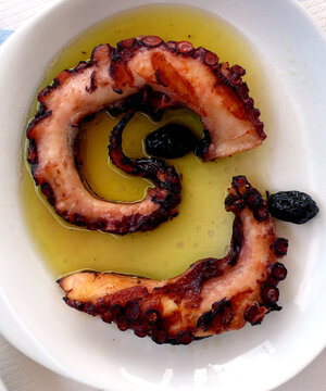 Grilled octopus legs with olive oil in Skala Eressos, Lesvos island, Greece.