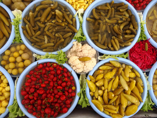 Different types of fruit and vegetable pickles in a farmers market in Istanbul, Turkey.