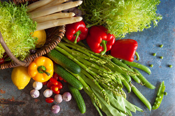 Vegetables in basket with fresh raw food. Top view. Selective focus