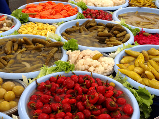 Different types of fruit and vegetable pickles in a farmers market in Istanbul, Turkey.
