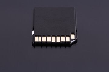 SD storage memory flash card isolated on black background. storage technologies concept.