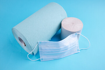 corona panic concept. toilet paper roll with medical face mask. outer space.