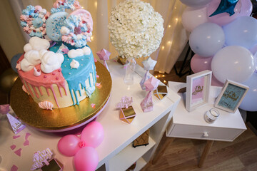 Gender reveal party cake and decorations