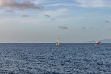 Fototapeta na wymiar Sailboat and ferry boat at sea in Saint Vincent and the Grenadines
