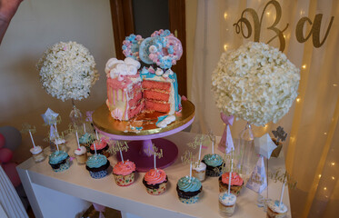 Gender reveal party cake and decorations