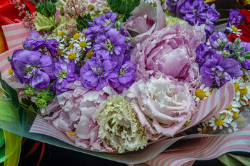 beautiful bouquet of peonies, gillyflowers and daisies close up