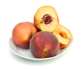 sweet peaches in plate on a white background 