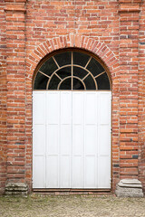 Door on the red brick wall old building