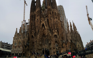 Front of the la sagrada de familia in Barcelona church cathedral under construction build crane...