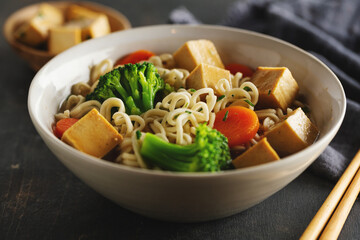 Vegan asian soup with noodles and tofu