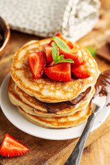Freshmade pancakes served with strawberry and choco paste
