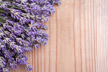 Flat lay lavender flowers on wooden background with copy space
