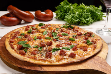 Homemade Pizza with ground  Pepperoni Sausage. Pizza topped with Brazilan 