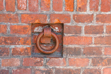 A metal ring embedded in the wall