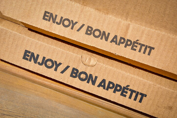 Enjoy bon appetit signs in cardboard box