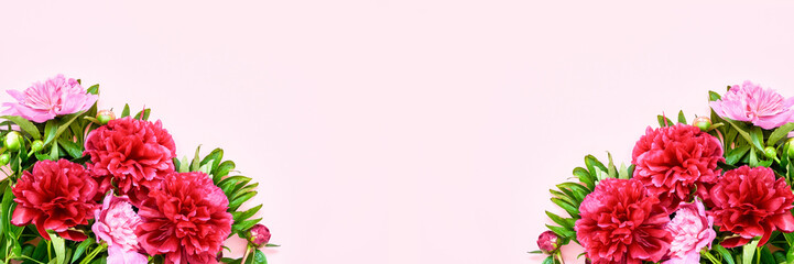 Pink Holiday banner. Bouquet of pink peonies on pink background. Mothers day, Valentines Day, Birthday celebration concept. Copy space, top view