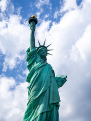 Fototapeta premium close front view of Statue of Liberty in America on a hot summer day