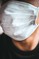 Concept : Virus COVID-19 that still lives as normal Only we can't see. Concept : Life after pandemic. Asian men wear masks to protect against viruses. selective focus, Black and white picture.