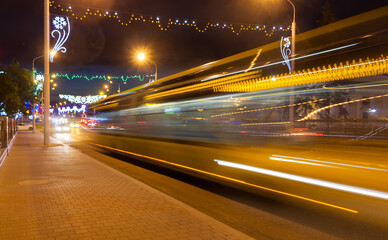 Fototapeta na wymiar Motion blurred bus overpass in the evening.