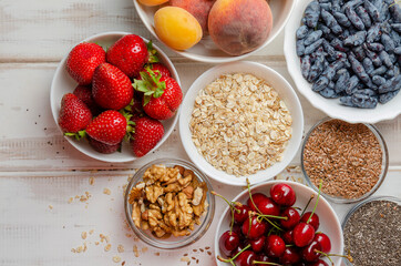 ingredients for making musdi or smoothie. Nuts, seeds, berries