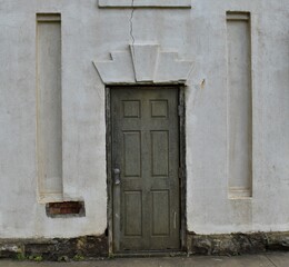 Art deco doorway, antique and rustic.  Cracked plaster.