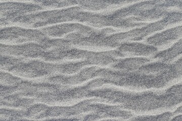 Ripples in sand at the beach, interesting texture and pattern.