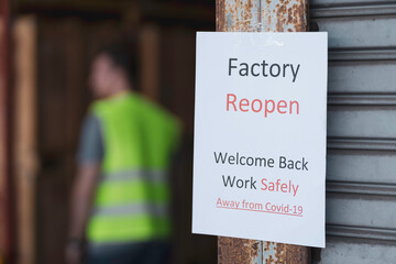 Sign paper about factory reopening after Covid 19 lock down measure 