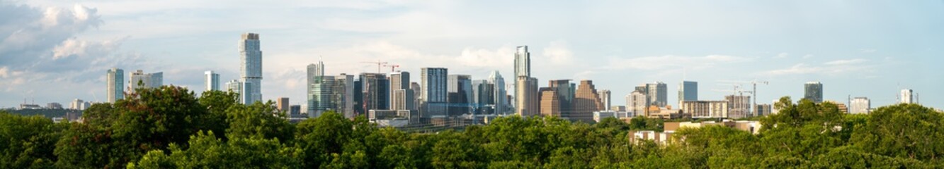 Fototapeta na wymiar Austin, Texas - June 25, 2020: View of Downtown Austin Skyline with Multiple Constructions Cranes During Daytime