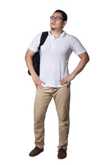 Fototapeta premium Young Asian male student wearing glasses looking up and thinking while holding backpack. Full body portrait