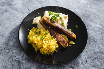 plant-based food, vegan sausages with sauerkraut and mash potatoes