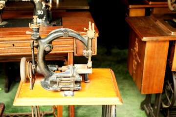 Very old vintage sewing machine on wood table