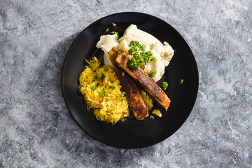 plant-based food, vegan sausages with sauerkraut and mash potatoes