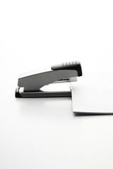 Fastening papers with a stapler