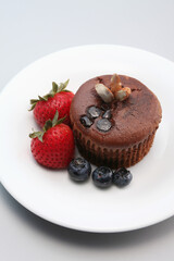 Chocolate chip muffin with berries